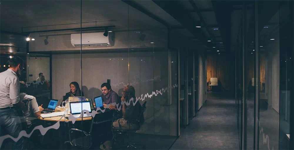 Employees working in a conference room