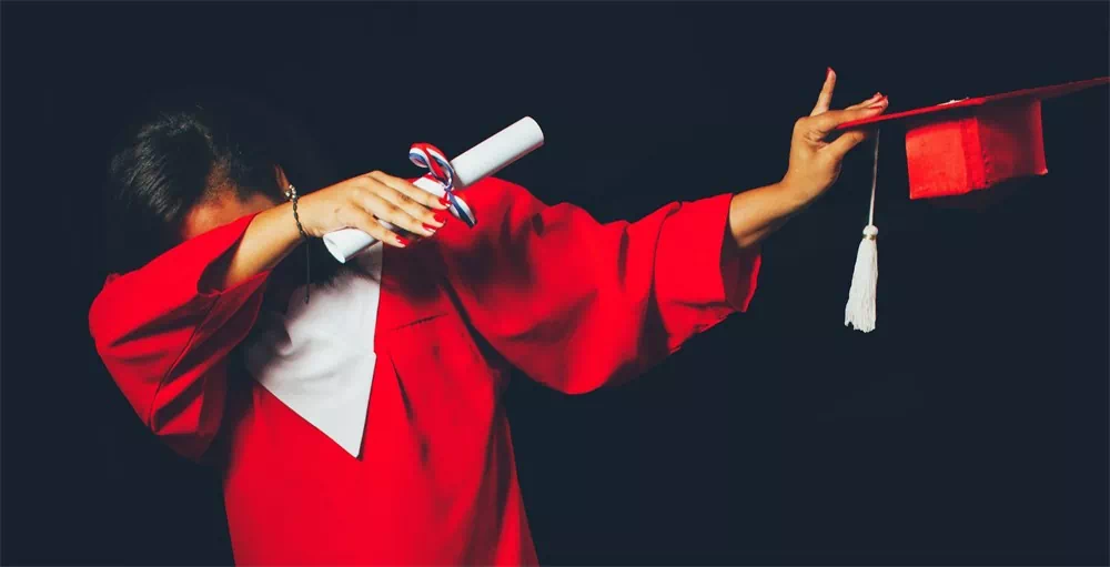 college student in red graduation gown