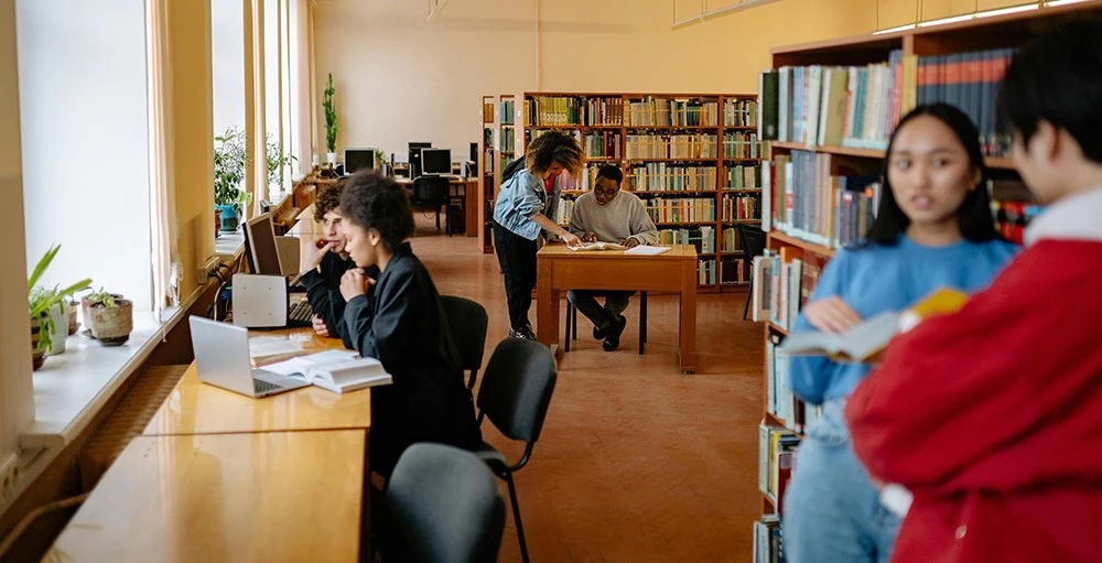 college students studying inside the library